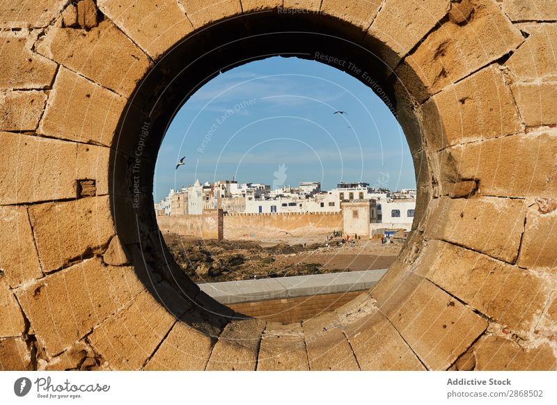 Stone monument with round hole Monument Town Ancient Essaouira Morocco Round Hole Abstract Rock Circle Sky Blue Picturesque Vantage point Old Architecture