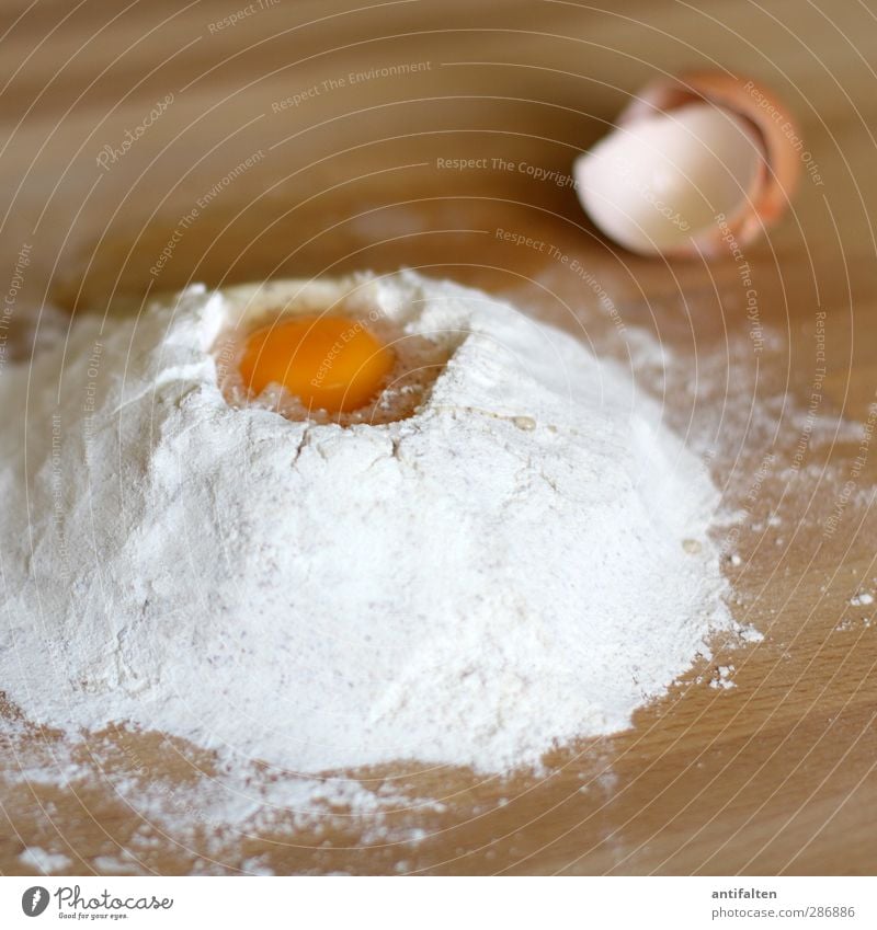 Bake bake cake Food Dough Baked goods Cake Egg Flour Nutrition To have a coffee Brown Yellow White Cooking Eggshell Yolk Table Wooden table Cookie Mulde