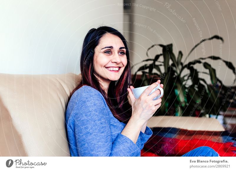 young caucasian woman having coffee at home Breakfast Beverage Coffee Tea Lifestyle Happy Leisure and hobbies Sofa Human being Feminine Young woman