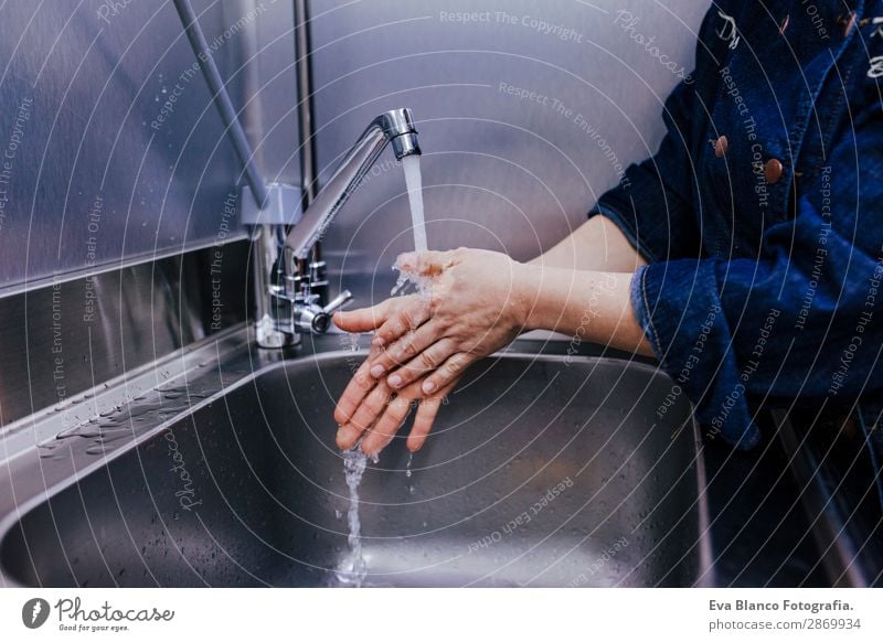 woman washing hands in bakery business. indoor Personal hygiene Bathroom Business Feminine Woman Adults Hand Fingers 1 Human being 45 - 60 years Wet Clean