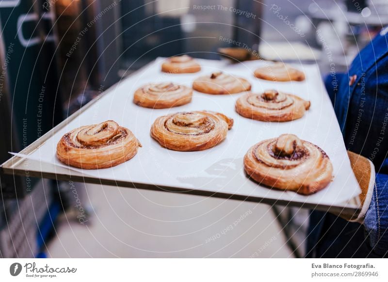 woman holding holding rack of sweets in a bakery Bread Happy Kitchen Restaurant School Work and employment Profession Camera Woman Adults Building Stove & Oven