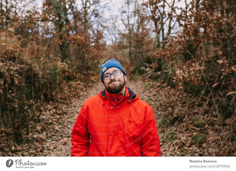 young man enjoys nature in the middle of an autumn forest Lifestyle Style Happy Beautiful Body Relaxation Leisure and hobbies Trip Adventure Hiking Boy (child)