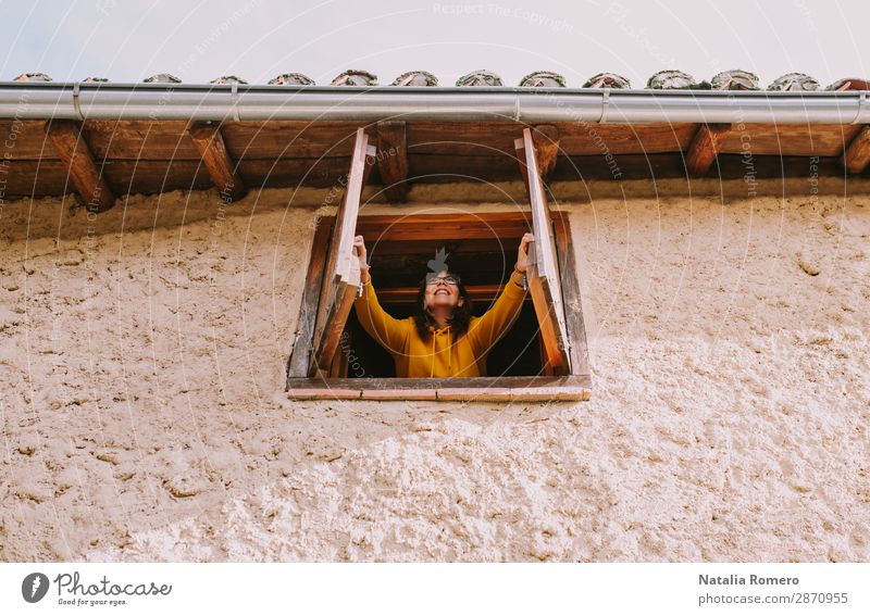 a young woman opens the window of a rural house Lifestyle Joy Beautiful Healthy Senses Meditation Cure Leisure and hobbies Vacation & Travel