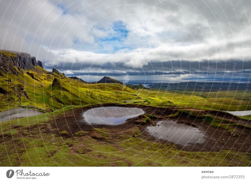 Quiraing, Scotland Vacation & Travel Tourism Mountain Hiking Nature Landscape Clouds Summer Autumn Climate Climate change Weather Grass Moss Coast