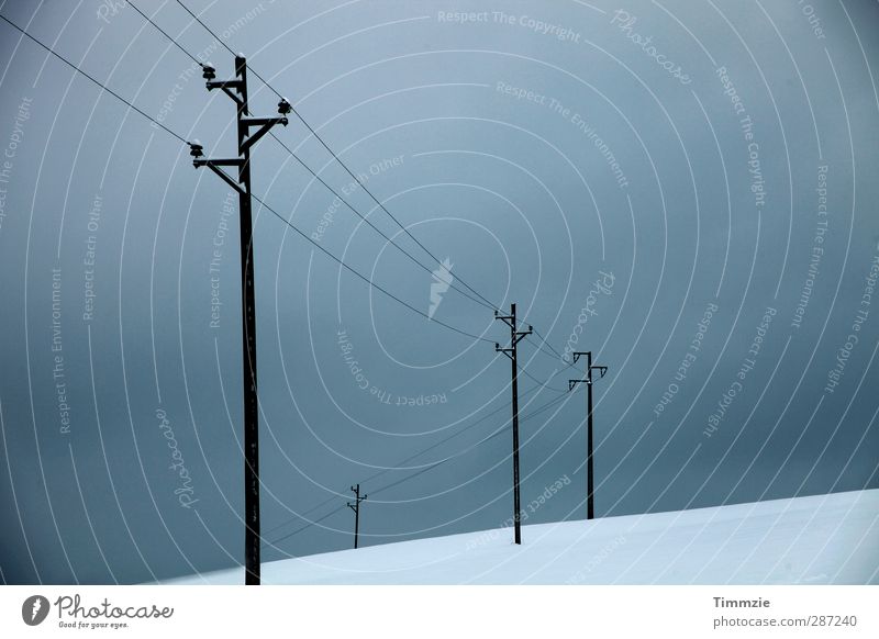 Power pylons in winter Telecommunications Landscape Clouds Storm clouds Winter Bad weather Snow Hill Electricity pylon Subdued colour Exterior shot Abstract