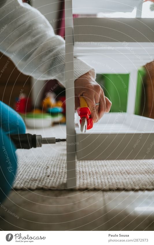 Woman assembling furniture at home Lifestyle Furniture Human being Young woman Youth (Young adults) Adults Hand 1 18 - 30 years Wood Work and employment Build