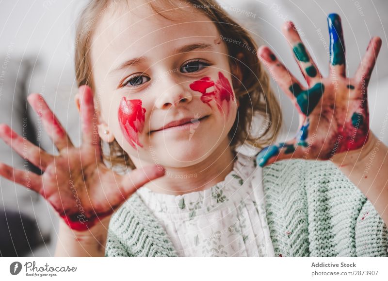 Girl with dirty hands coloring face Hand Dirty Colouring Face Painting (action, artwork) Funny Child Decoration Multicoloured Bright Woman Infancy Preparation