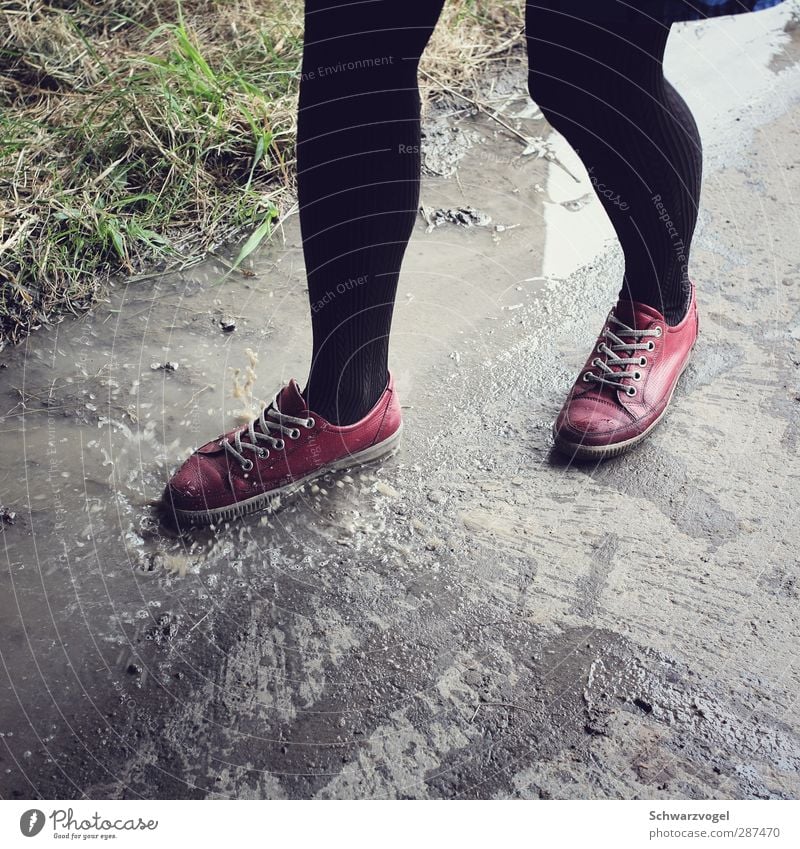 puddle child Weather Bad weather Rain Pedestrian Footwear Walking Brash Rebellious Gray Red Black Moody Infancy Joie de vivre (Vitality) Ease Nature fun