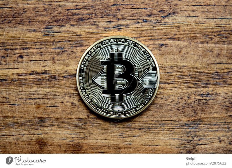 Golden Bitcoin Coin Close Up Shopping Money Economy Financial Industry Financial institution Business Internet Wood Metal Paying White Electronic Cryptocurrency