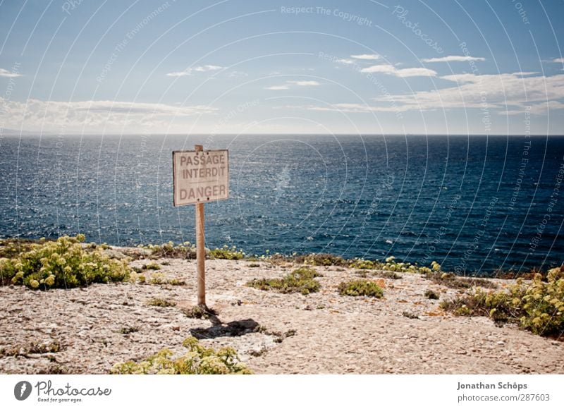 DANGER sign on cliff Environment Nature Landscape Sky Horizon Beautiful weather Adventure Far-off places Freedom Corsica Bonifacio coast Slope Cliff Risk