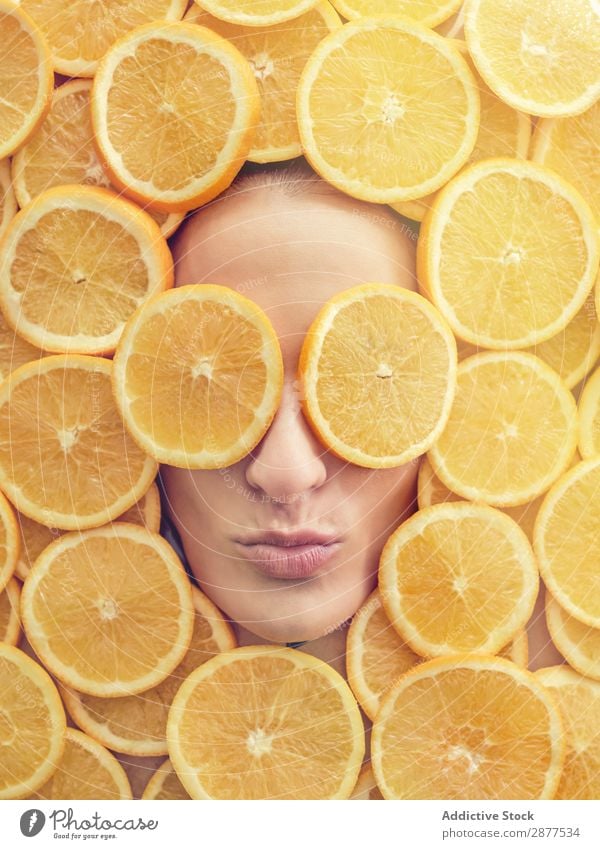 Smiling woman between slices of orange Face Woman Orange Slice Fresh Conceptual design Happy Youth (Young adults) Beautiful Beauty Photography Healthy