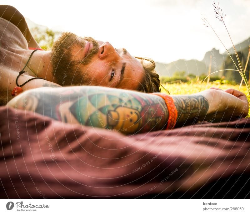 be flat Man Human being Lie Meadow Tattoo Tattooed Relaxation Calm Motionless Facial hair Beard Blanket Picnic Grass European Caucasian Loneliness Nature