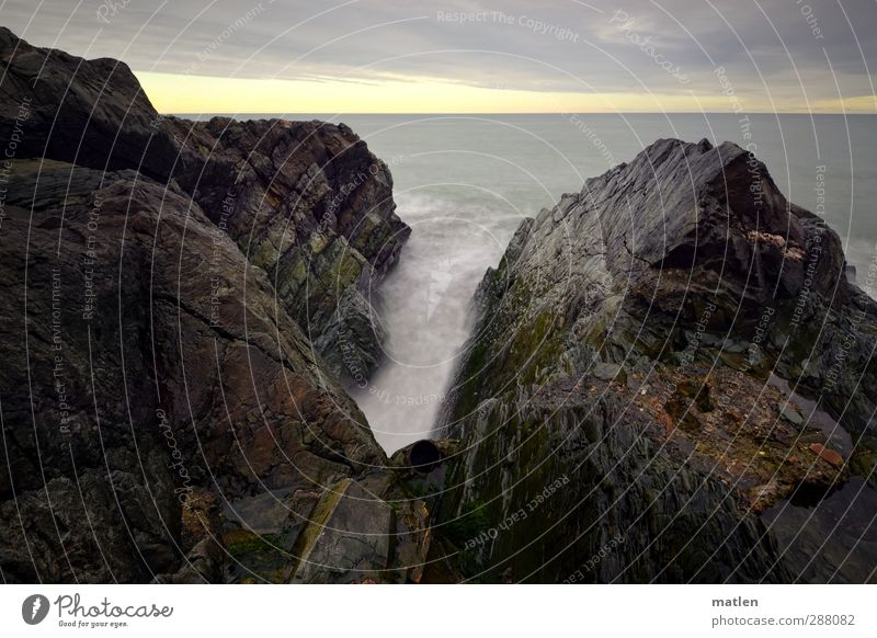 tube Landscape Sky Clouds Horizon Sunlight Winter Weather Rock Canyon Coast Ocean Blue Brown Gray squidgy wave Pipe Subdued colour Exterior shot Deserted Day