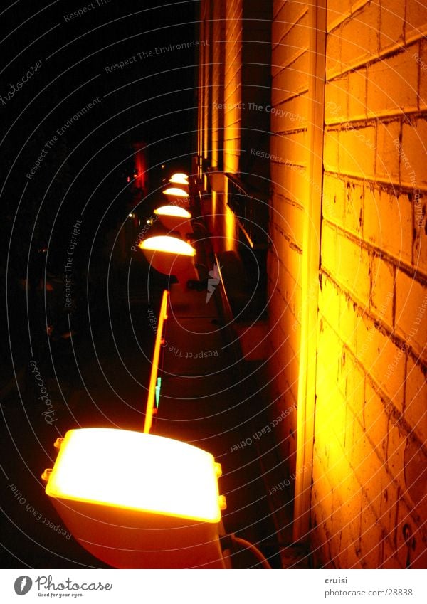 Wall in the light Light Lamp Night Black Dark Building Facade Brick Bright Yellow Architecture Floodlight Seam Orange