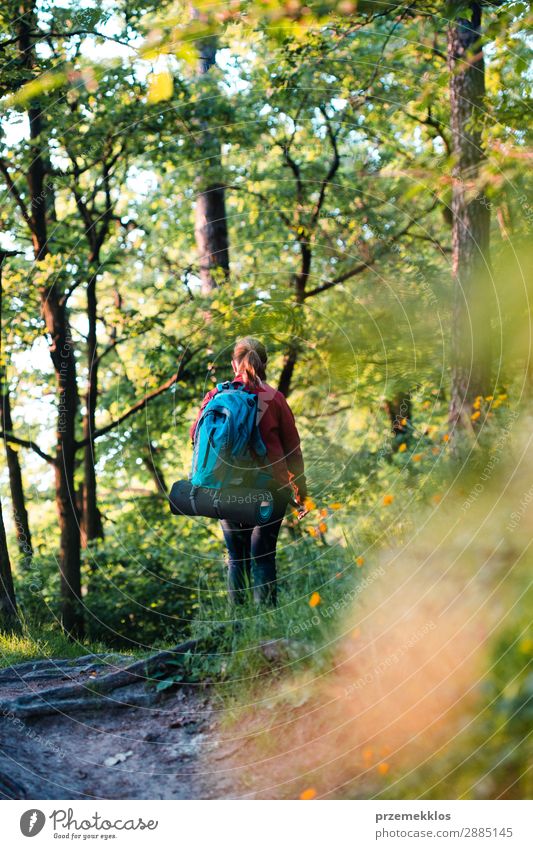 Woman hiker with backpack walking in forest during summer trip Lifestyle Beautiful Relaxation Leisure and hobbies Vacation & Travel Adventure Freedom Summer