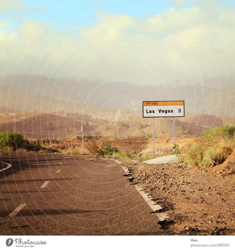 Viva Las Vegas Landscape Earth Sky Clouds Bushes Hill Rock Tenerife Street Driving Signs and labeling Road sign Colour photo Multicoloured Exterior shot