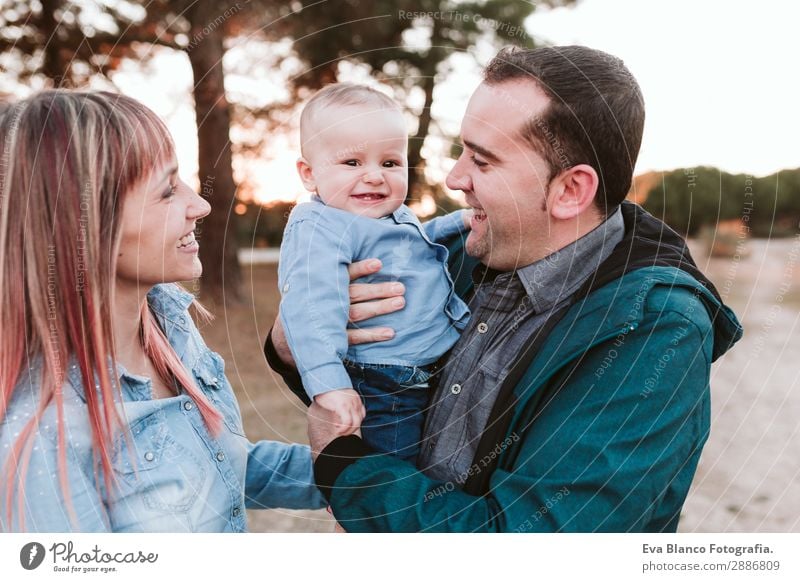 happy family outdoors at sunset. Family concept Lifestyle Joy Happy Beautiful Relaxation Playing Vacation & Travel Sun Child Human being Masculine Feminine Baby