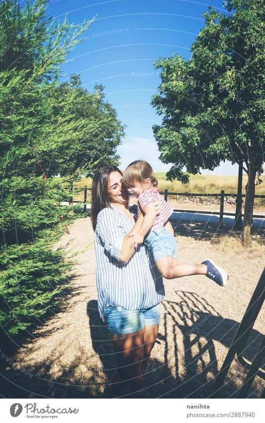 Mom and daughter having fun together in a park Lifestyle Joy Playing Summer Parenting Child Human being Feminine Toddler Girl Woman Adults Mother