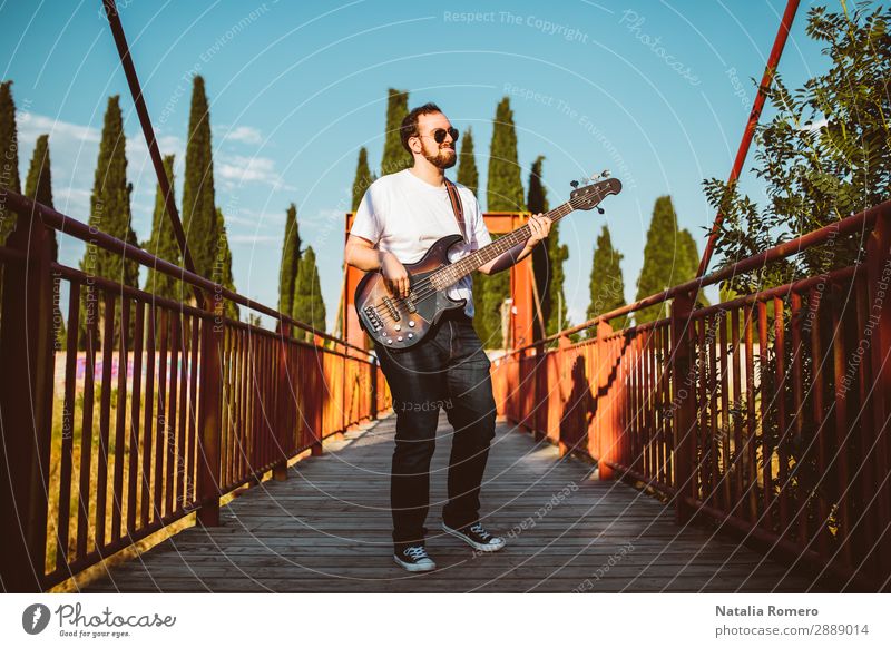 outdoor photo session with a bass player and his instruments Playing Entertainment Music Human being Man Adults Concert Band Musician Guitar Nature Rock Black