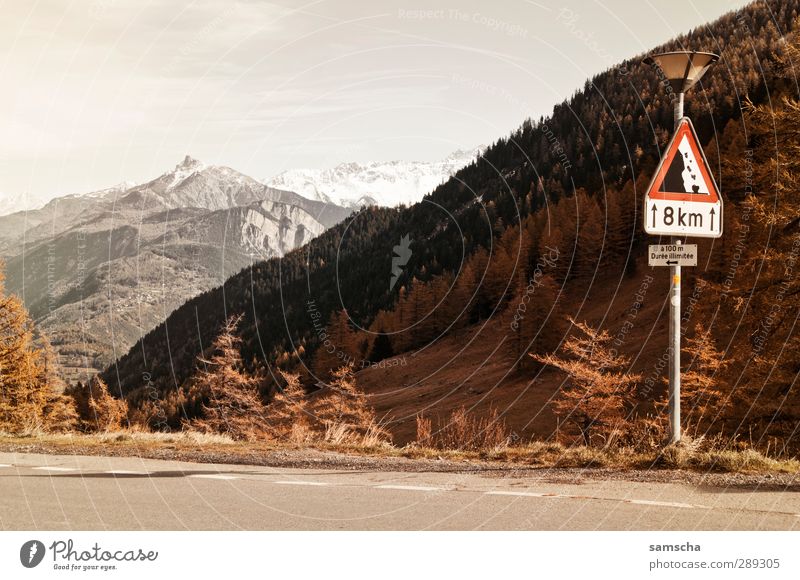 on the Forclaz Mountain Environment Nature Landscape Sky Climate Climate change Hill Rock Alps Peak Snowcapped peak Traffic infrastructure Street Road sign Sign