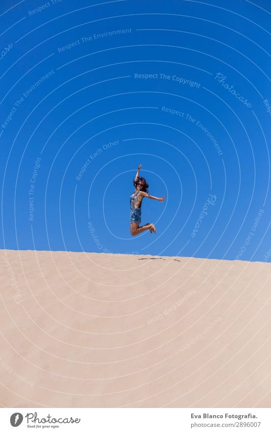 young woman jumping on dunes in Portugal. Summertime Lifestyle Joy Happy Wellness Vacation & Travel Freedom Success Feminine Young woman Youth (Young adults)