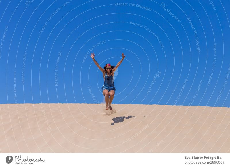 young woman jumping on dunes in Portugal. Summertime Lifestyle Joy Happy Wellness Vacation & Travel Freedom Success Feminine Young woman Youth (Young adults)