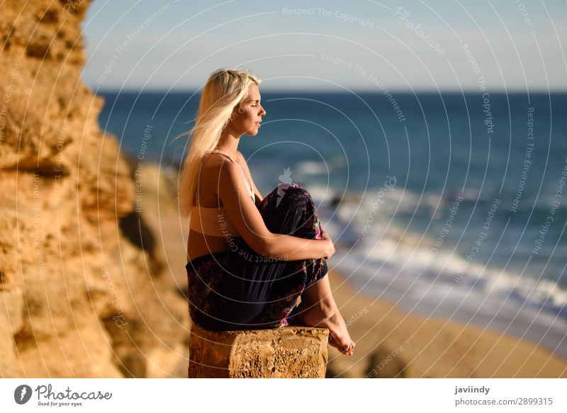 Woman enjoying the sunset on a beautiful beach Lifestyle Happy Beautiful Body Relaxation Meditation Leisure and hobbies Vacation & Travel Freedom Summer Sun