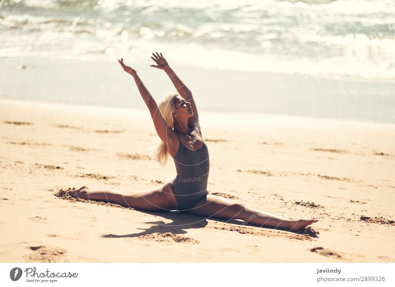 Caucasian blonde woman practicing yoga in the beach Lifestyle Beautiful Body Relaxation Meditation Summer Beach Ocean Sports Yoga Human being Feminine