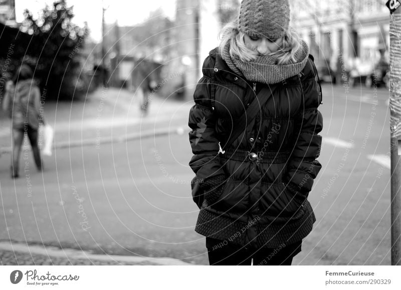 Walking down the street. Feminine Young woman Youth (Young adults) Woman Adults 1 Human being 18 - 30 years Town Street Pedestrian To go for a walk Coat