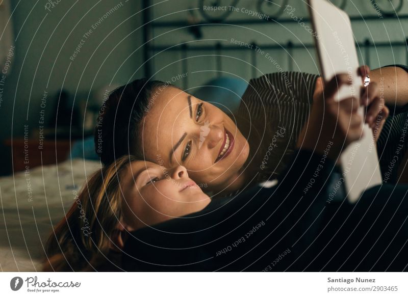 Mother and her child with digital tablet. Tablet computer Child Smiling Computer Playing Girl Family & Relations Education Small Daughter Son Together Digital