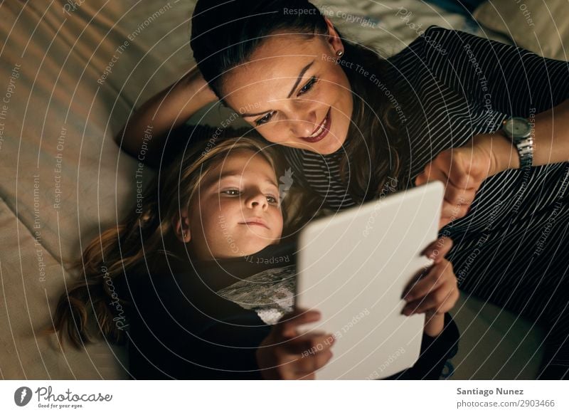 Mother and her child with digital tablet. Tablet computer Child Smiling Computer Playing Girl Family & Relations Education Small Daughter Son Together Digital