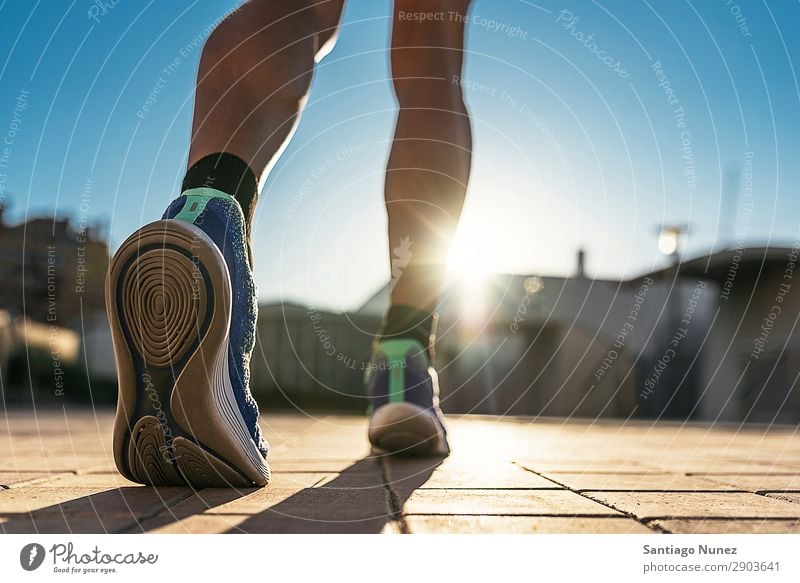 Close up of legs of runner in the city. Man Running Jogging Legs Calf Feet Runner Street City Athlete Speed Fitness Lifestyle Youth (Young adults) Town Action