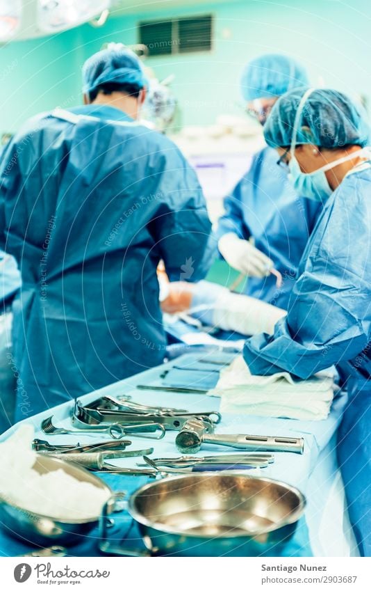 Team of Surgeons Operating. Operation Surgery operating surgical Hospital Room Doctor Theatre Medication Work and employment Group instrumental clinic Man Woman