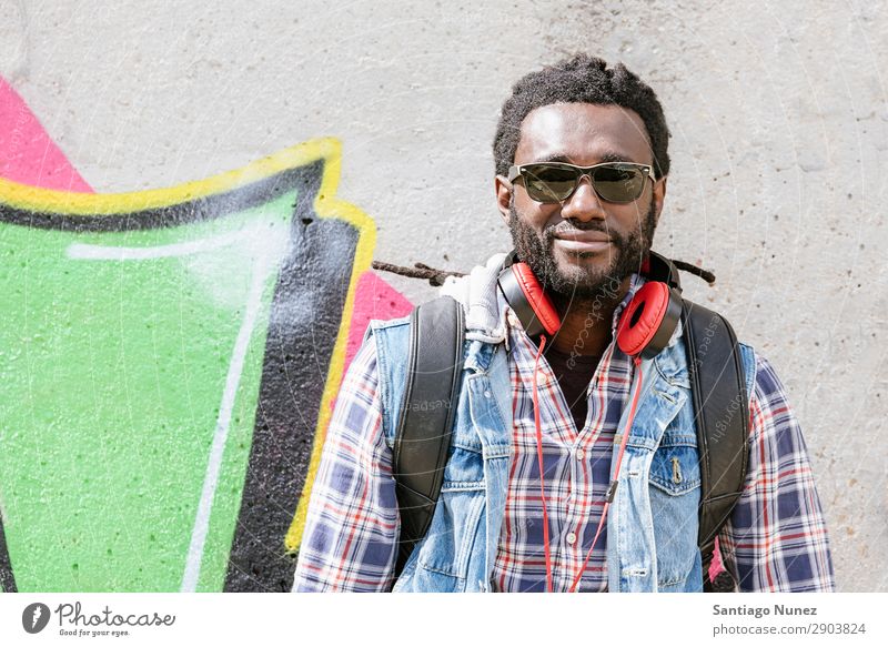 Portrait of a black man smiling. Adults African Afro American Attractive Background picture Black Headphones Easygoing Cool (slang) Expression Face handsome