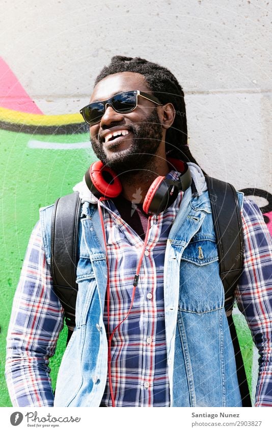 Portrait of a black man smiling. Adults African Afro American Attractive Background picture Black Headphones Easygoing Cool (slang) Expression Face handsome