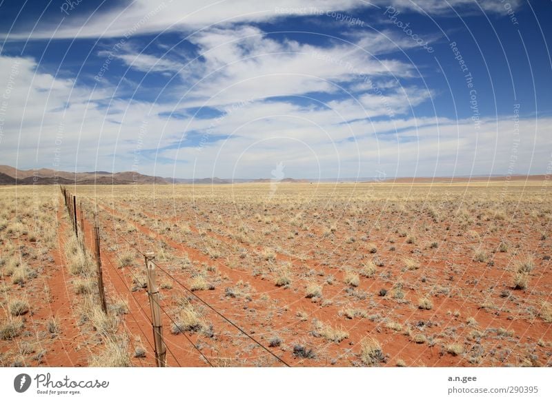 Namib Desert Rim Landscape Earth Sand Sky Clouds Horizon Summer Namib desert Red Blue Far-off places Nature Africa Namibia Fence Deserted Grass Eternity