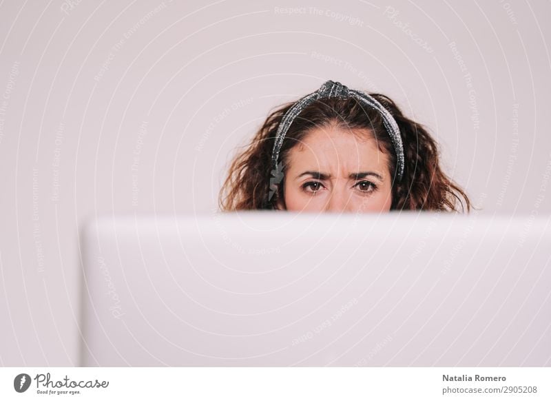 Brunette woman looking carefully at her computer screen Coffee Lifestyle Happy Desk Table Work and employment Office Business Telephone Computer Notebook