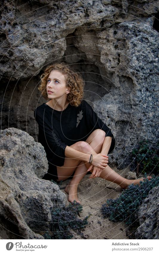 Young woman sitting between stones Woman Stone Attractive Sit Youth (Young adults) Charming Rock Lifestyle Curly Hair and hairstyles hairdo Calm