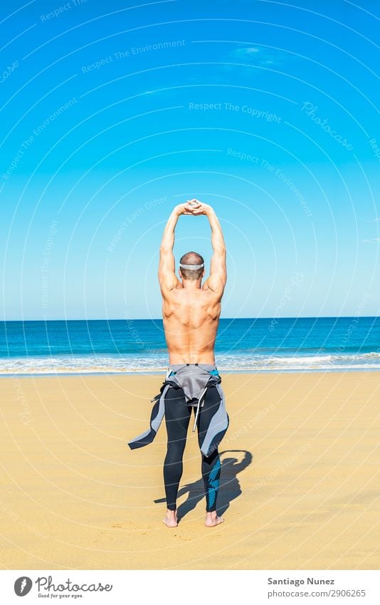 fitness man swimmer training stretching Beach Black Caucasian Diver Practice Athletic Fitness Person wearing glasses Skiing goggles handsome Healthy Lifestyle