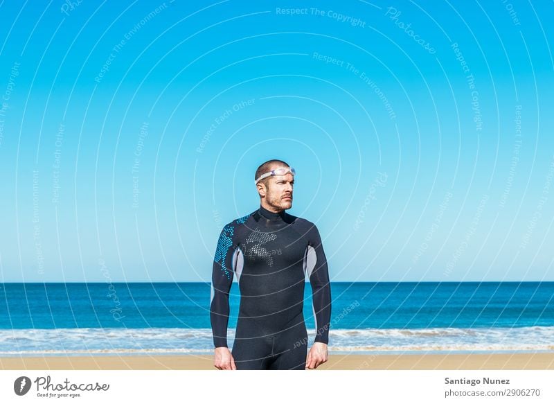 Handsome Swimmer ready to start swimming Beach Black Caucasian Diver Practice Athletic Fitness Person wearing glasses Skiing goggles handsome Happy Healthy