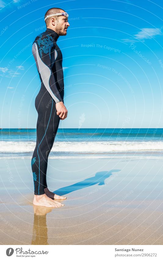 Handsome Swimmer ready to start swimming Attractive Beach Black Caucasian Diver Practice Athletic Fitness Person wearing glasses Skiing goggles handsome Happy