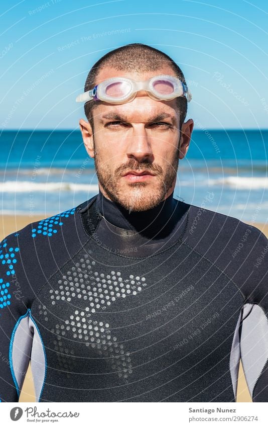 Handsome Swimmer ready to start swimming Beach Black Caucasian Diver Practice Athletic Fitness Person wearing glasses Skiing goggles handsome Happy Healthy