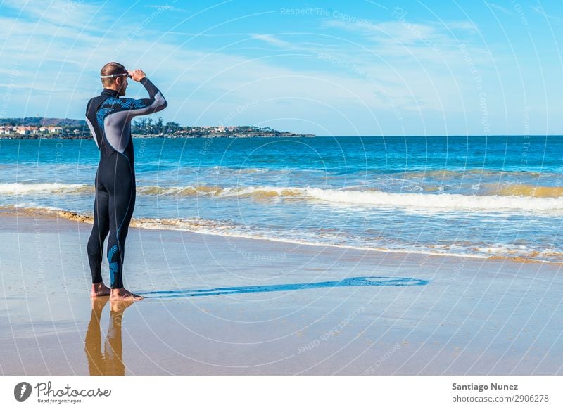 swimmer ready to go swimming in the sea Attractive Beach Black Caucasian Diver Practice Athletic Fitness Person wearing glasses Skiing goggles handsome Healthy