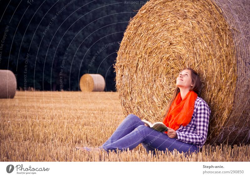 late summer reading Feminine Young woman Youth (Young adults) 1 Human being 13 - 18 years Child Book Summer Field Shirt Jeans Scarf To enjoy Smiling Reading