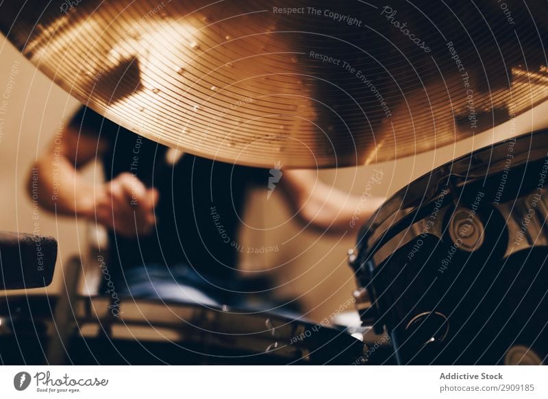 Man with headphones playing on drums Headphones Drum Playing Positive handsome Studio shot Music Professional Youth (Young adults) Drummer Equipment device