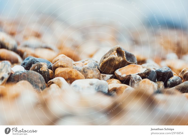 Stones on the beach close-up Environment Nature Coast Lakeside River bank Beach Ocean Island Esthetic Brighton England Pebble beach Macro (Extreme close-up)