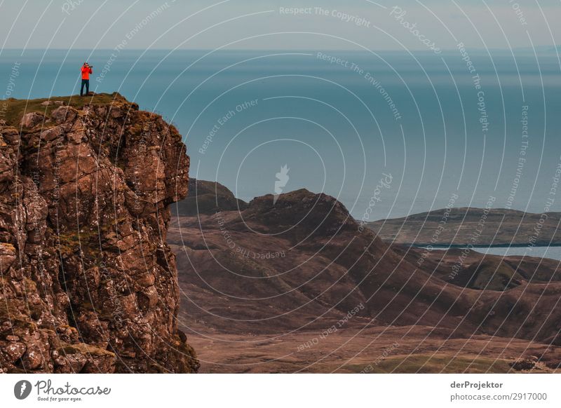 A photographer takes pictures of the view on Isle of Skye VI Nature Environment Hiking Vacation & Travel Mountain Sea coast hike hiking trail Quiraing