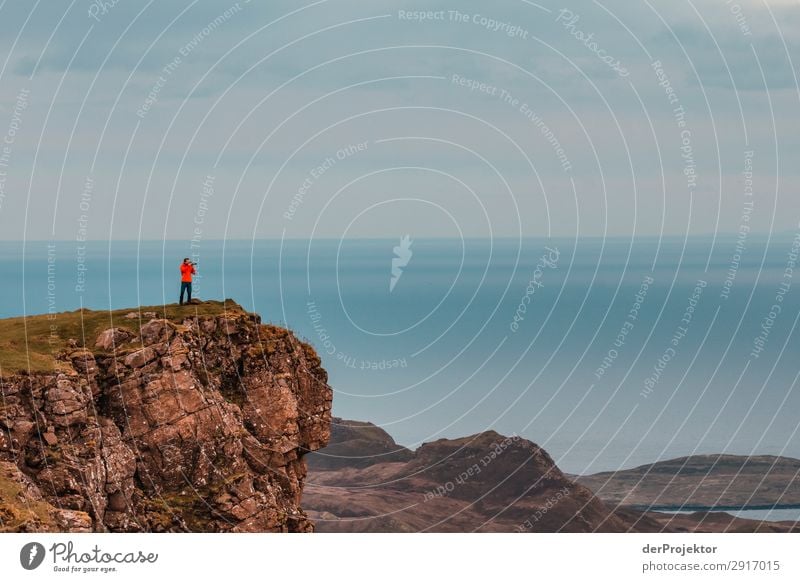 A photographer takes pictures of the view on Isle of Skye V Nature Environment Hiking Vacation & Travel Mountain Sea coast hike hiking trail Quiraing Front view