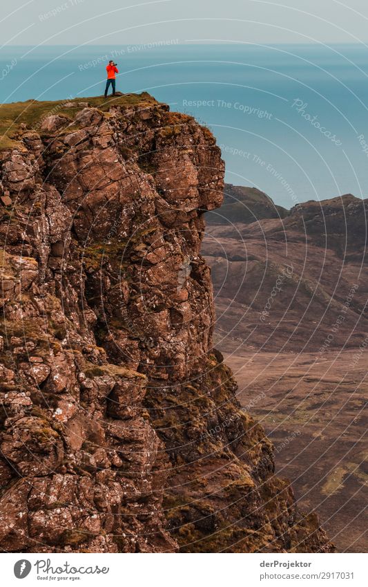 A photographer takes pictures of the view on Isle of Skye Nature Environment Hiking Vacation & Travel Mountain Sea coast hike hiking trail Quiraing Front view