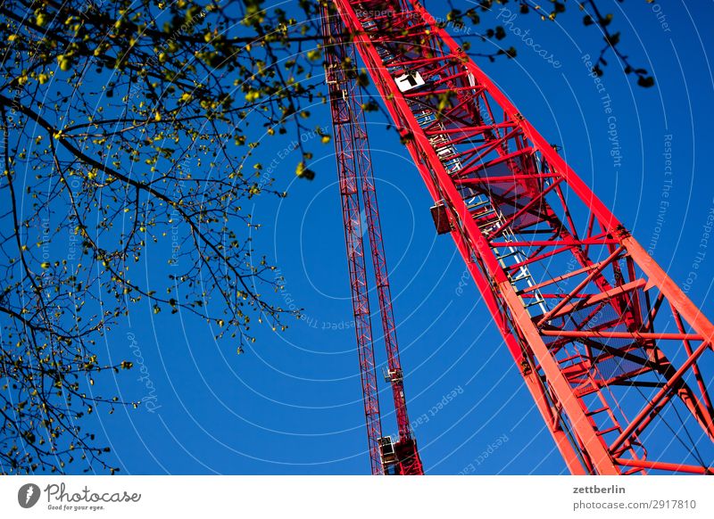 Construction site in spring slewing crane Worm's-eye view Building Commerce Labor union Sky Heaven Blue sky Sky blue Industry Crane Montage